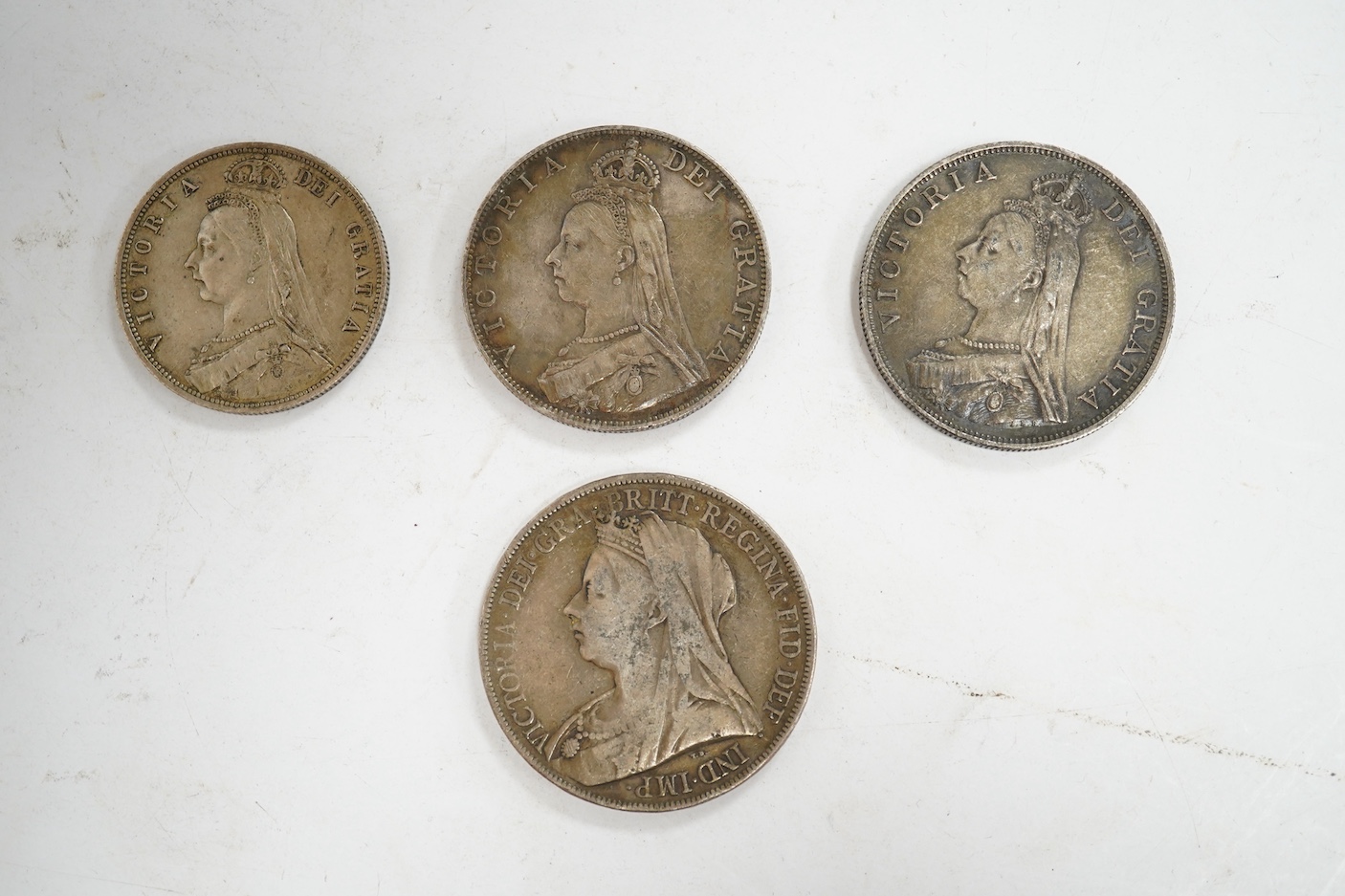 British coins, Victoria, a silver crown, 1900, two double florins, 1887 and a halfcrown, 1887